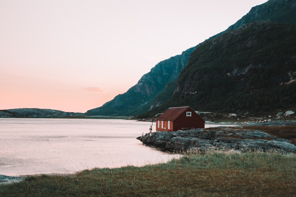 brown house beside body of water