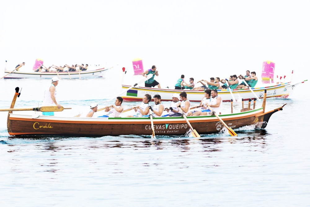 group of people rowing boat