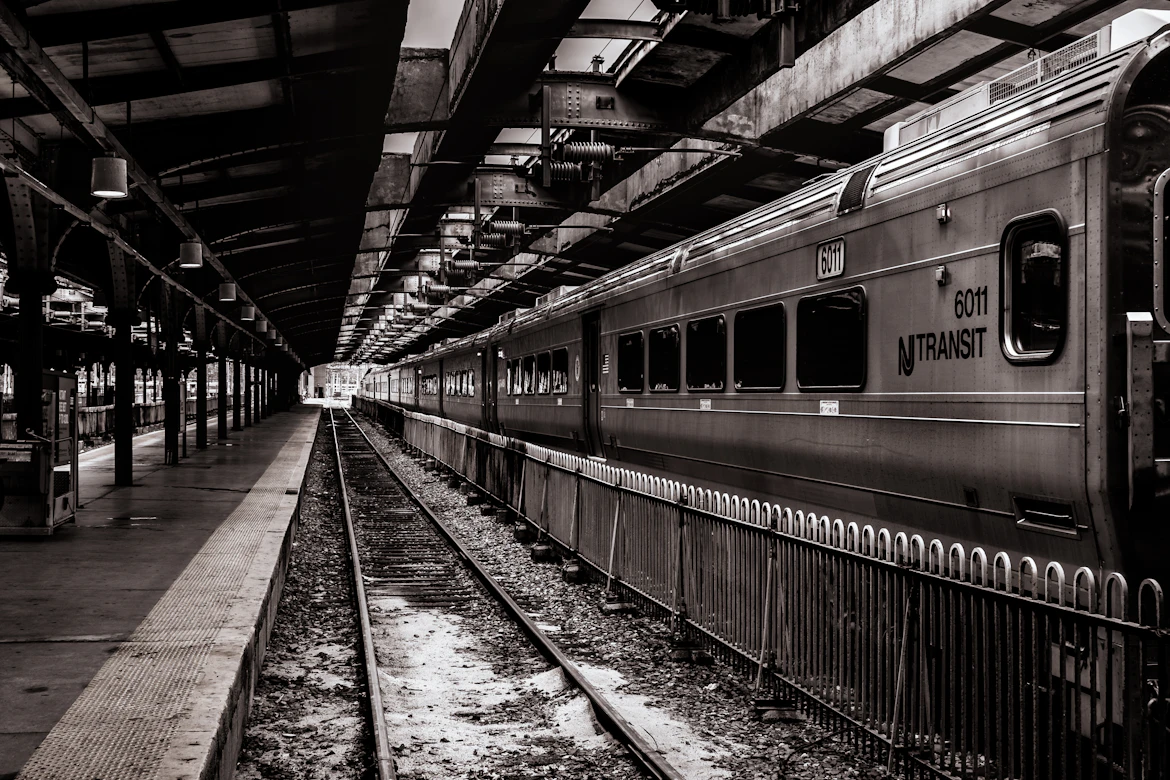 Commuter train at a New Jersey station on a clear day