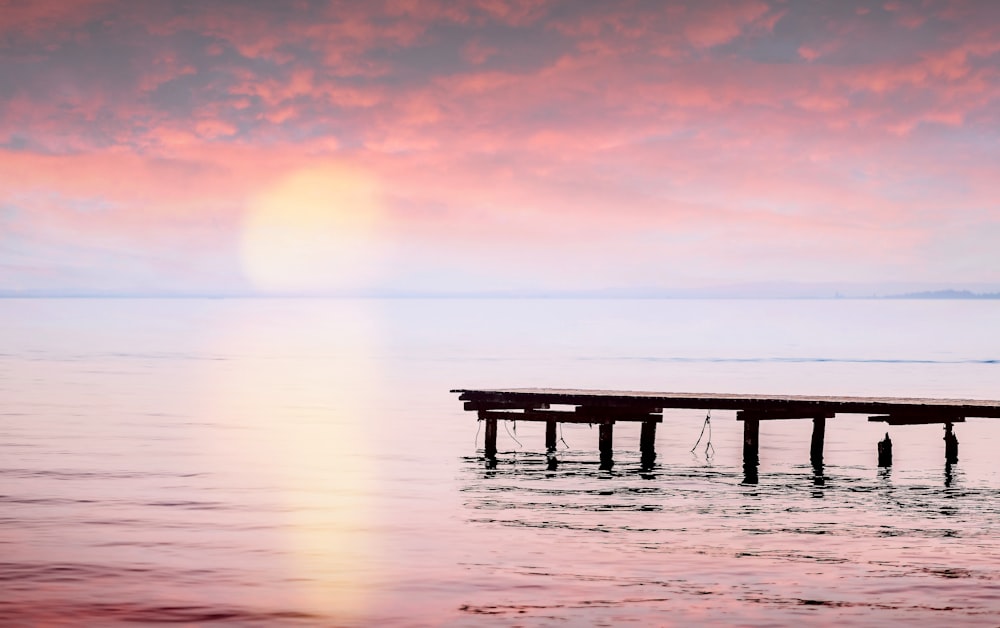 brown beach dock during golden hour