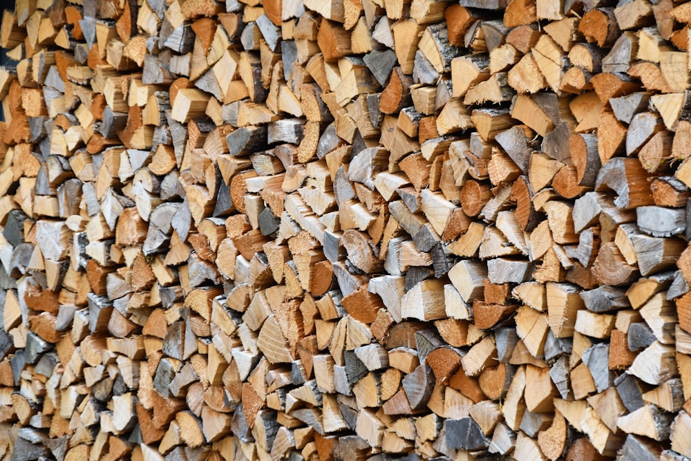 a large pile of wood sitting on top of a wooden floor