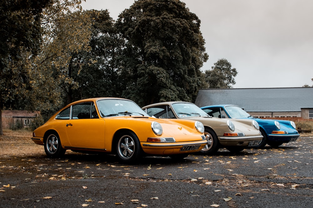 blue, gray, and yellow coupe on gray floor