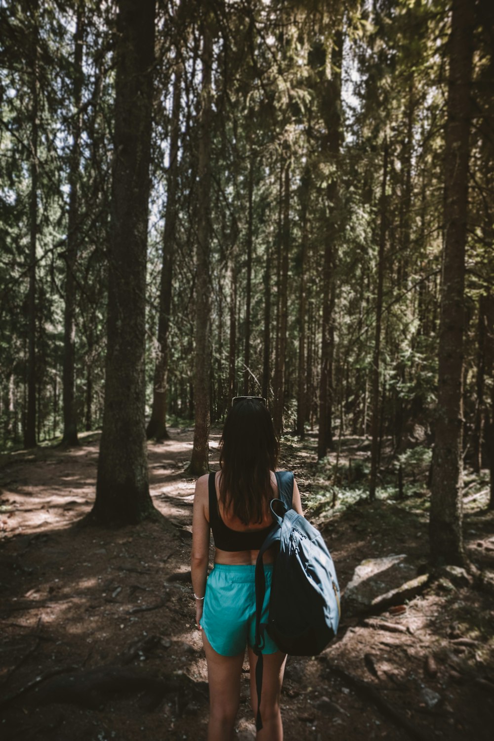 woman facing trees