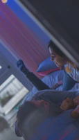 A couple comfortably relaxing on a sognovita bed, illustrating comfort and support.