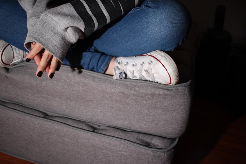 woman sitting on sofa