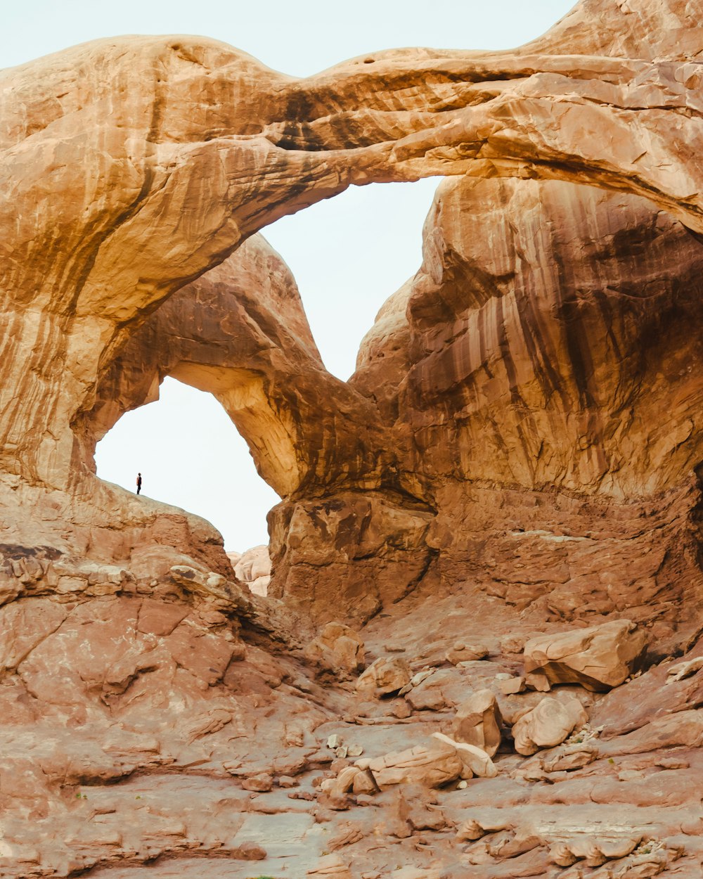 person standing on rock formation