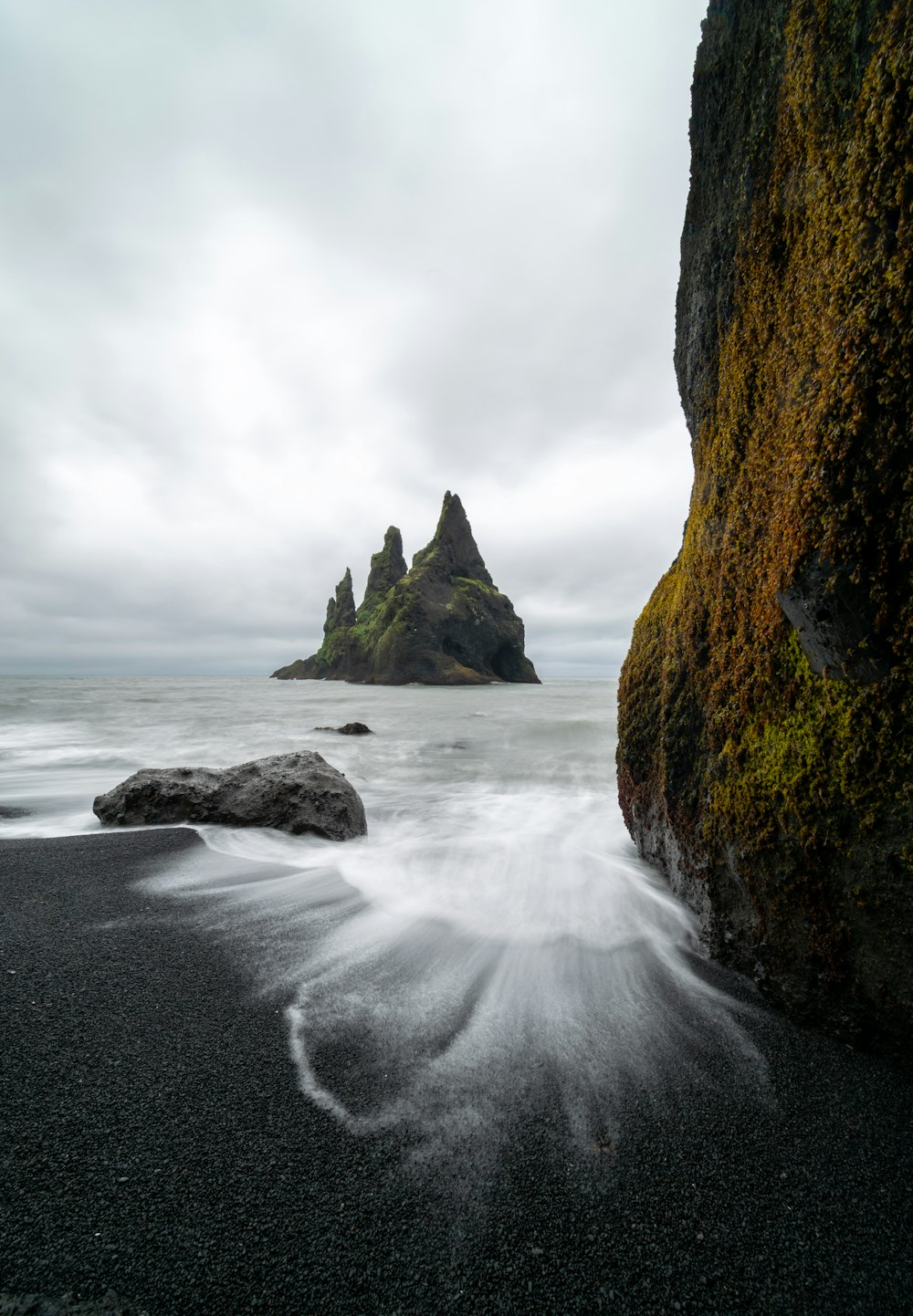 time lapse of shore near rock formation at daytime