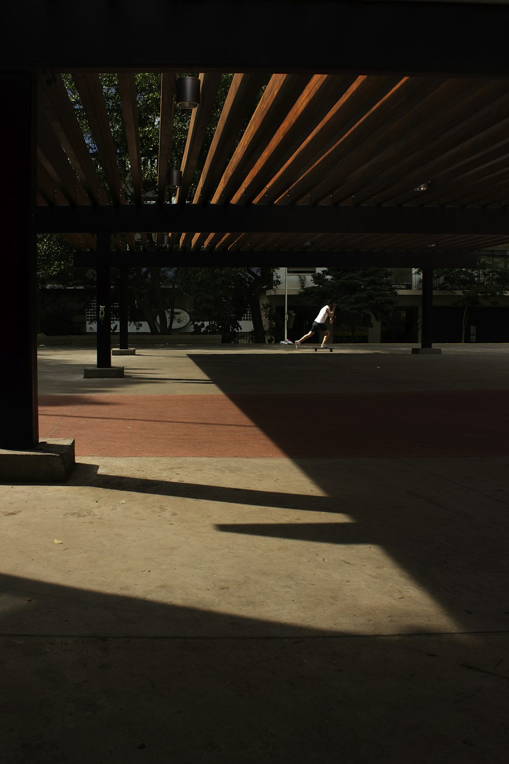 man skateboarding in open space