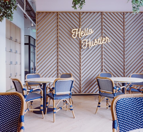 blue and brown wooden dining table and chairs inside room