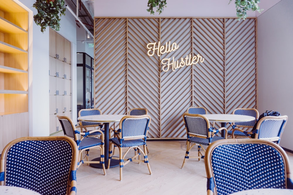 blue and brown wooden dining table and chairs inside room