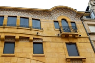 Finished building facade highlighting masonry and aluminum work.