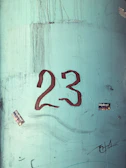 A neat curb featuring a local sports team logo alongside the home number.