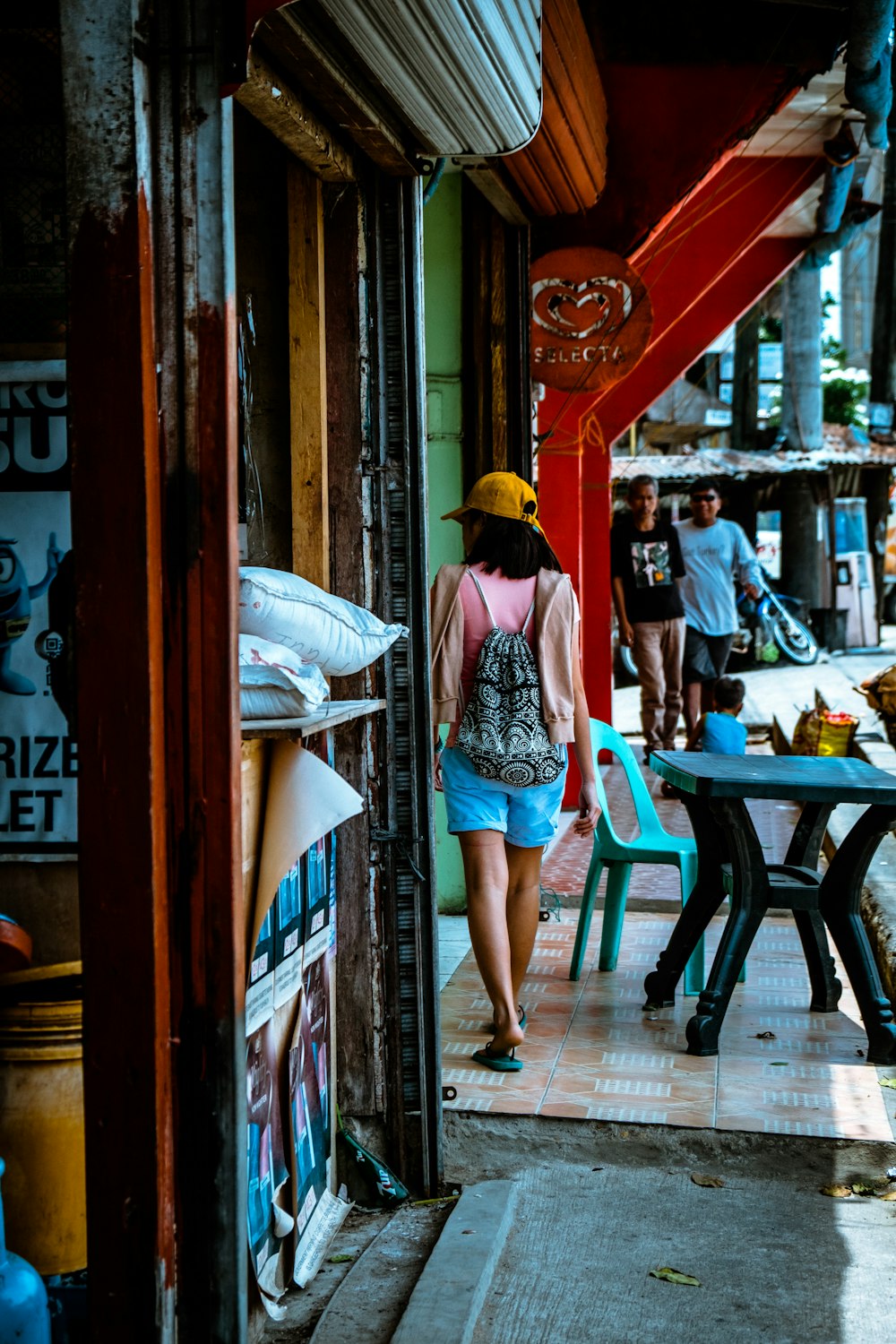 woman walking in front store