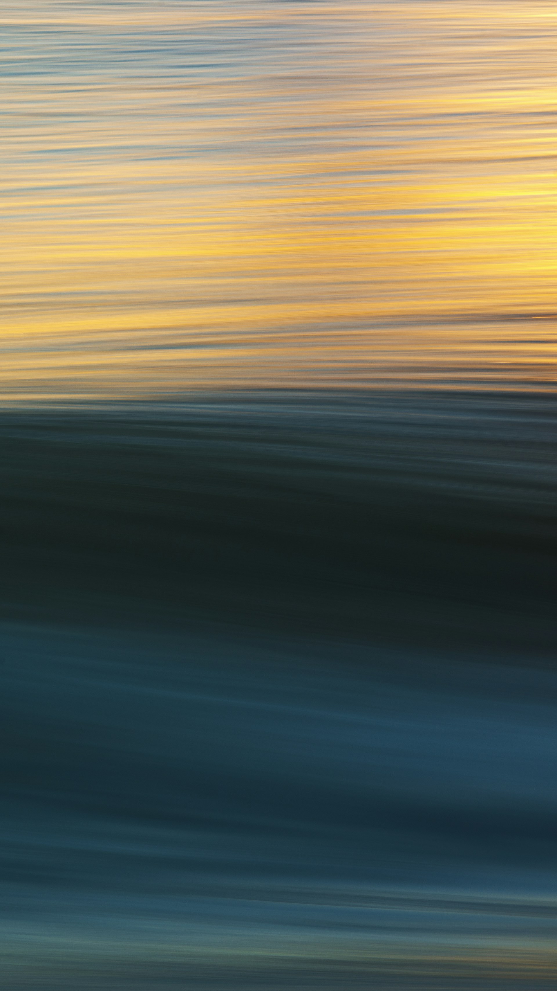 a person riding a surfboard on a wave in the ocean