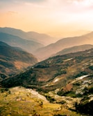 Local farmers in the Western Ghats tending to terraced fields at sunrise.