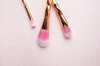 gold-colored makeup brushes