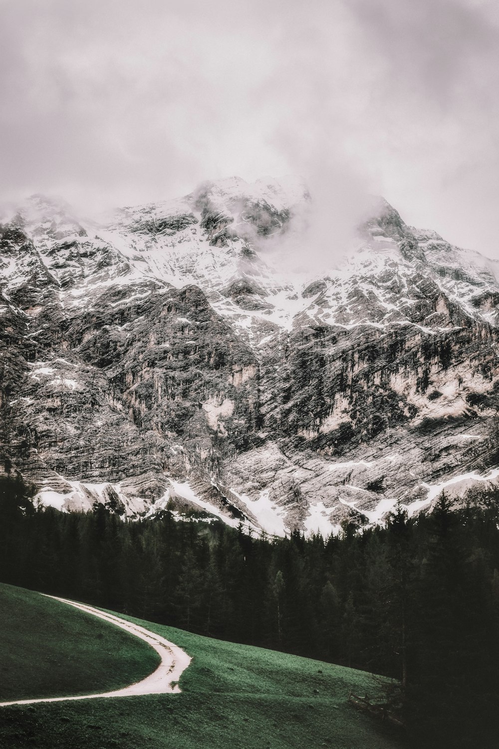 icy mountain under white clouds