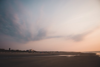 A serene beachfront property at sunset.