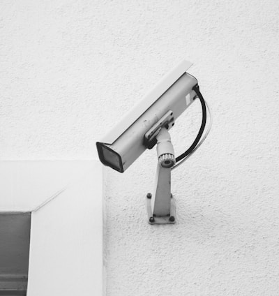 white security camera on white wall