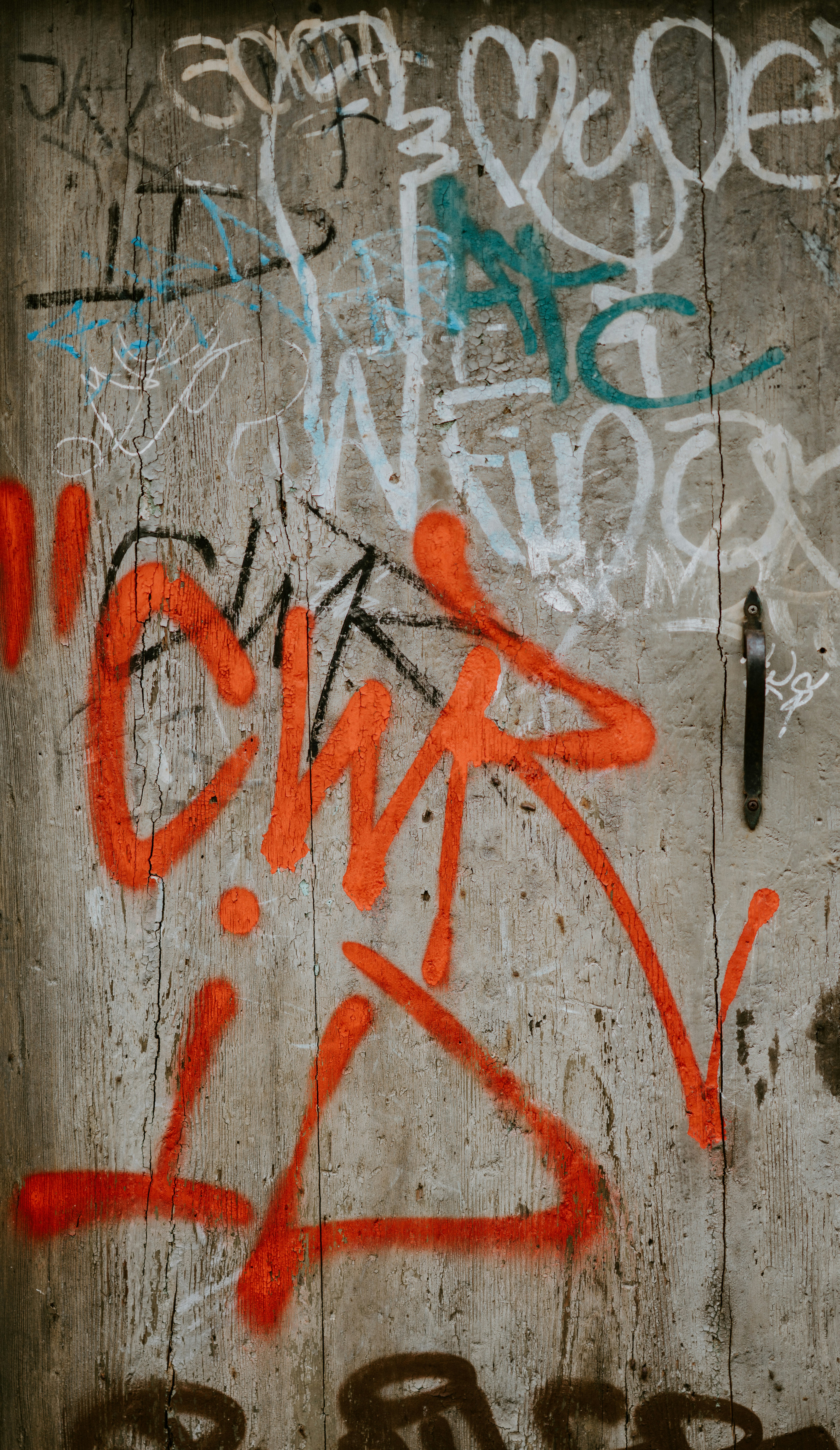 white and orange graffiti wall