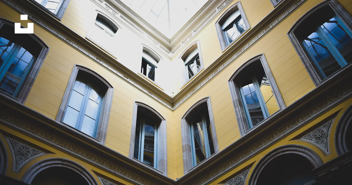 Construction Using Angles Low angle photo of yellow building - Free Photo on Unsplash