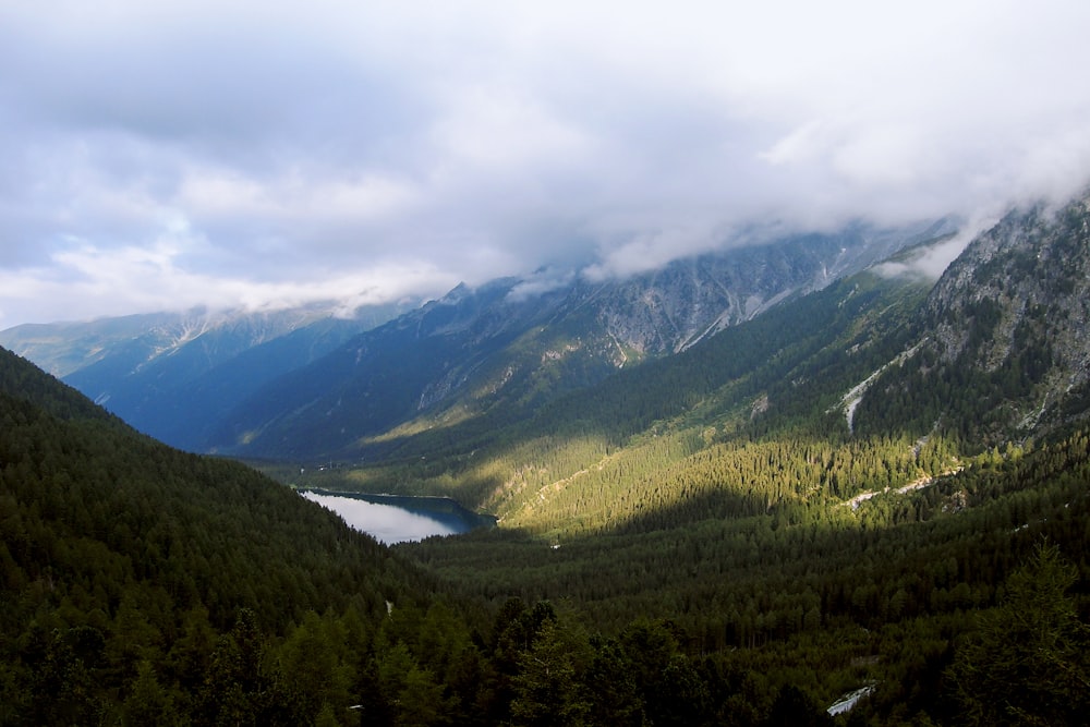 green mountain under white clouds at daytime