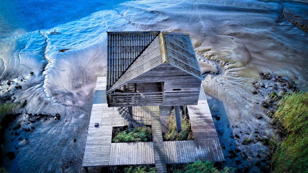 brown cottage beside beachline