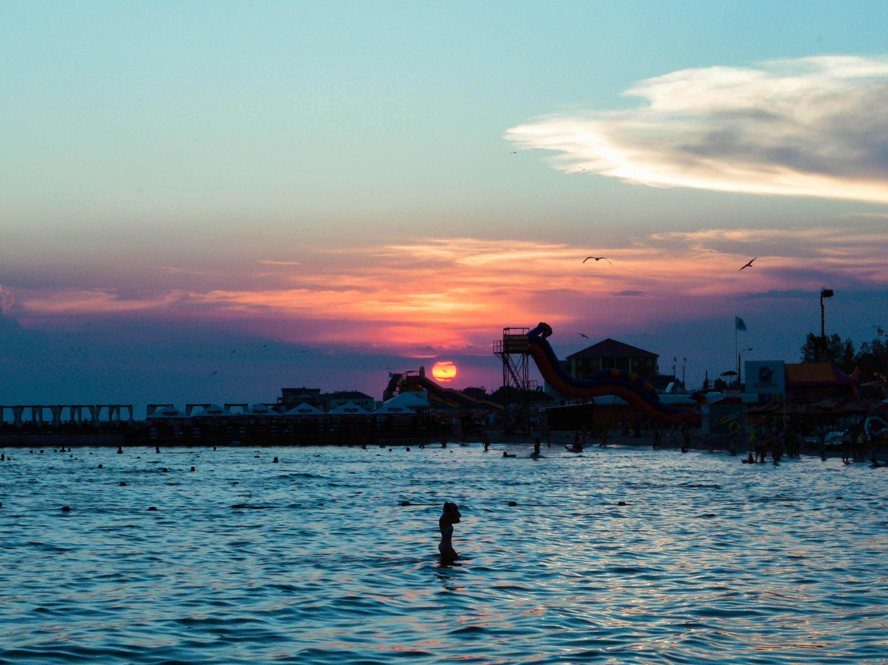 person bathing on body of water