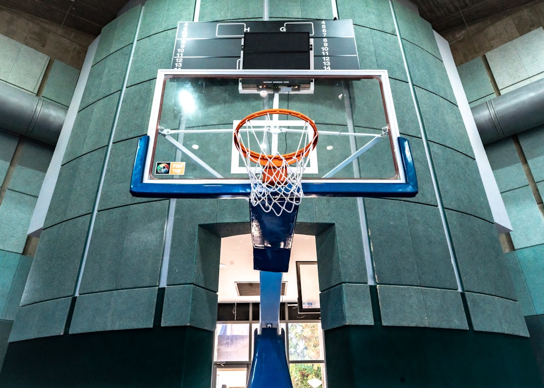 orange basketball hoop with clear glass backboard