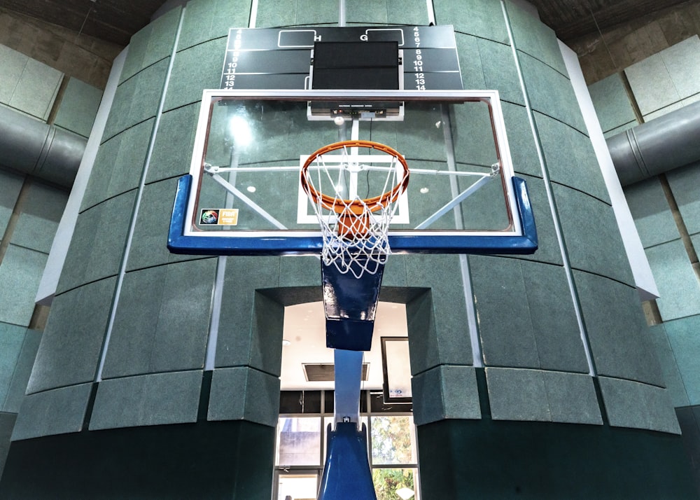 orange basketball hoop with clear glass backboard