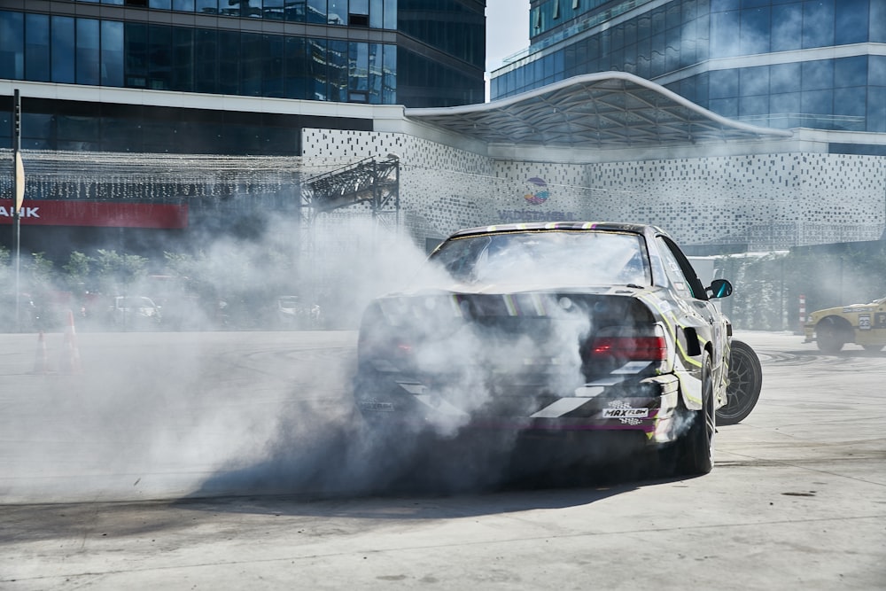 black car drifting during daytime