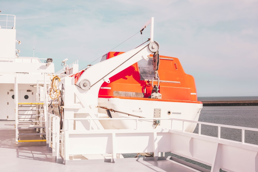 white ship on body of water during daytime