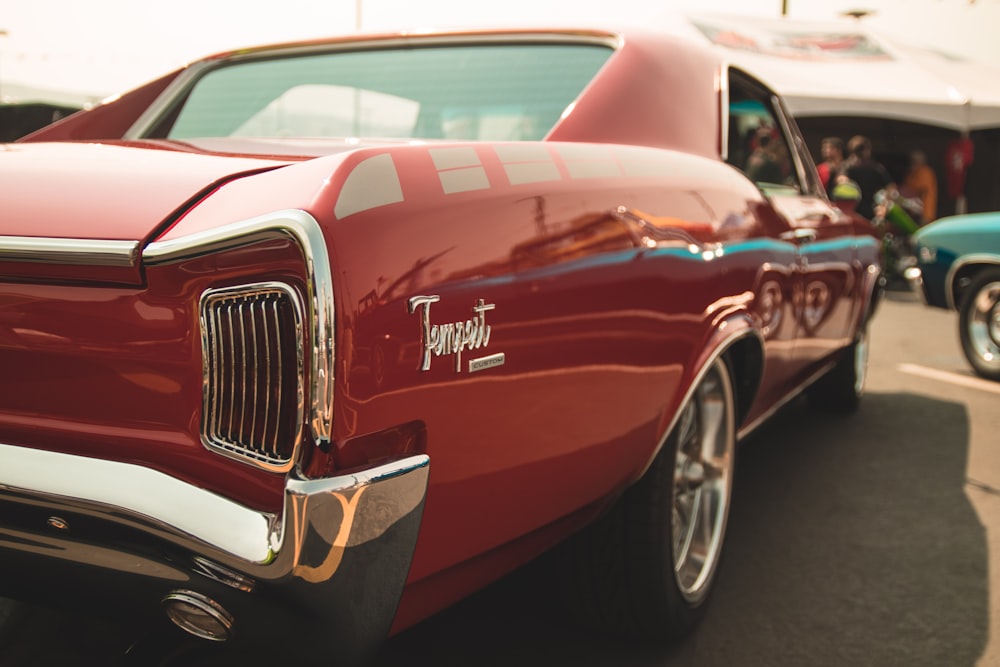 selective focus photography of red coupe