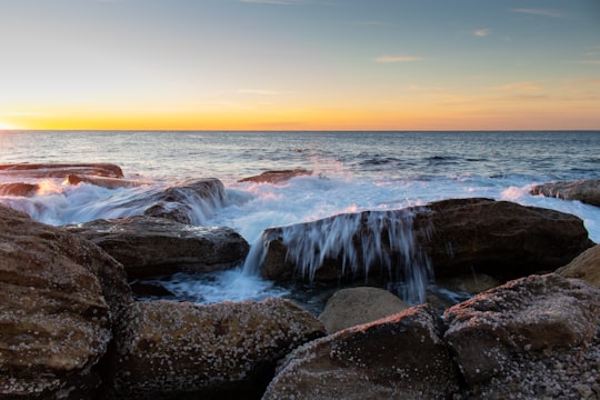 splash of water hitting rocks in Coogee Beach Australia