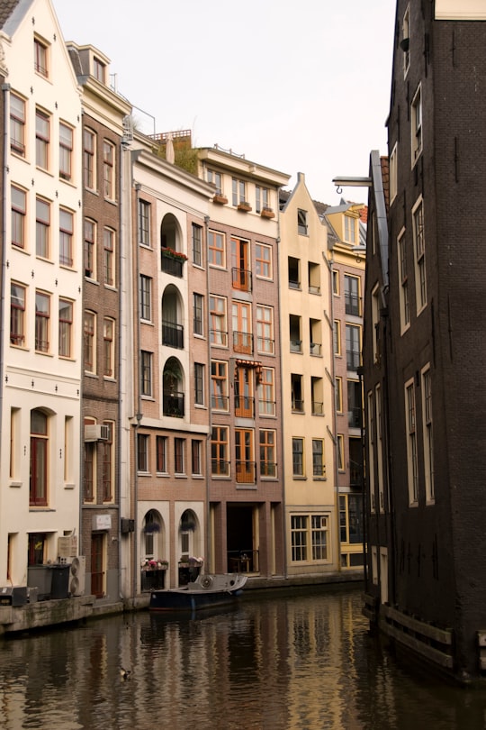 canal surrounded by buildings in Ons' Lieve Heer op Solder Netherlands