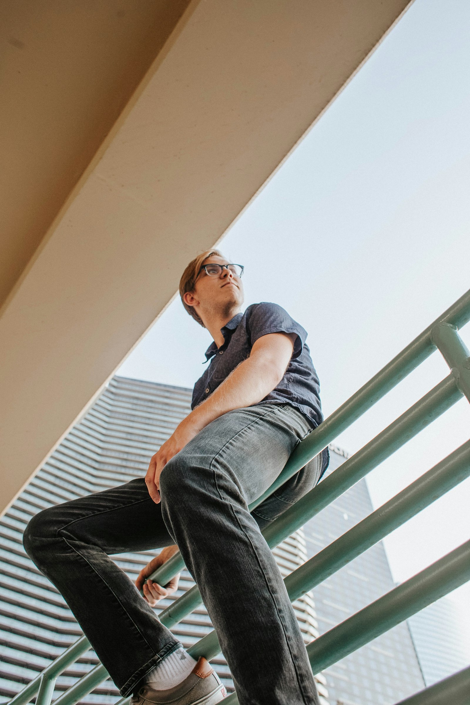 Canon EF 28mm F1.8 USM sample photo. Man sitting on gray photography