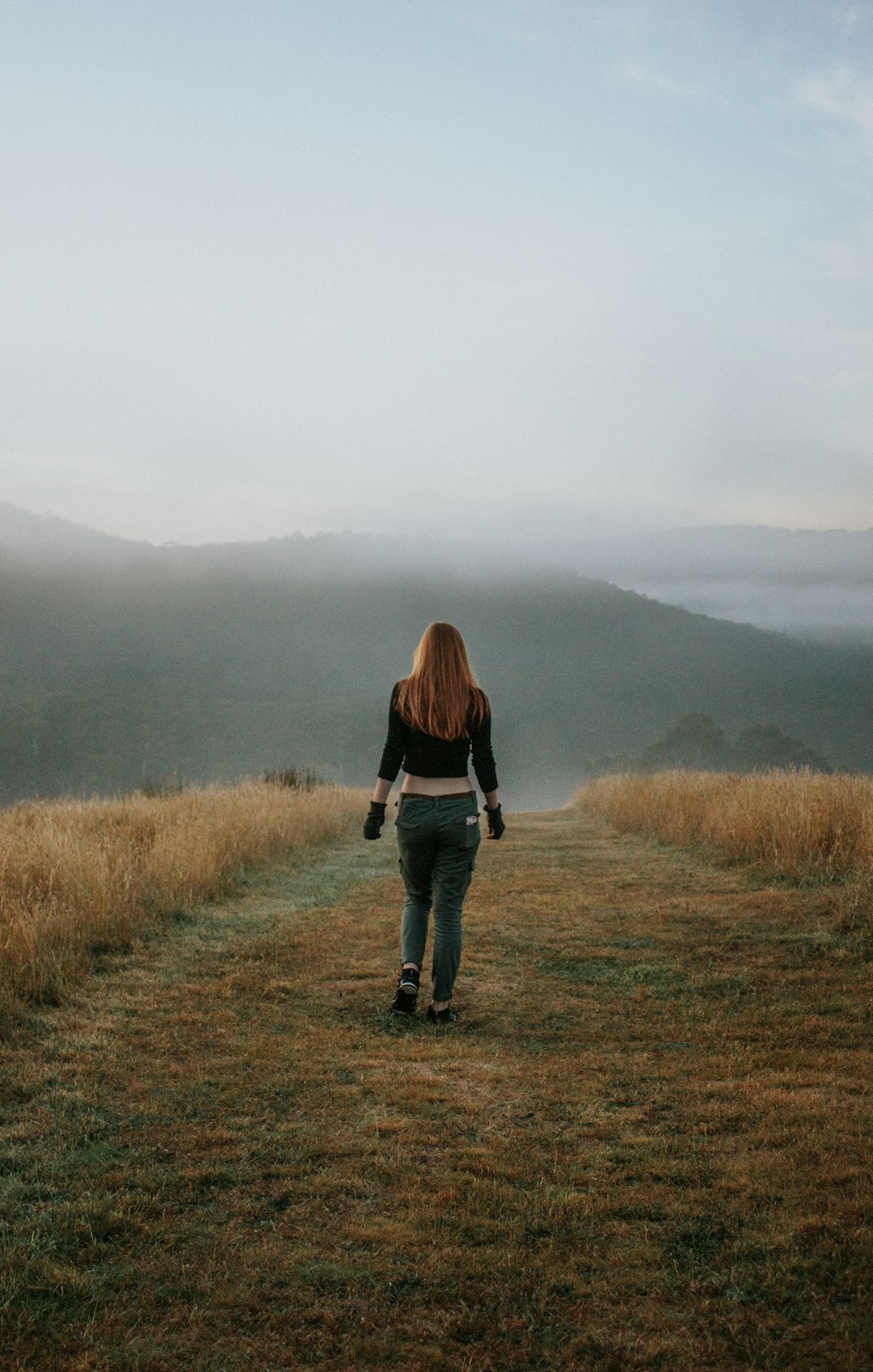 woman standing on grass during daytime