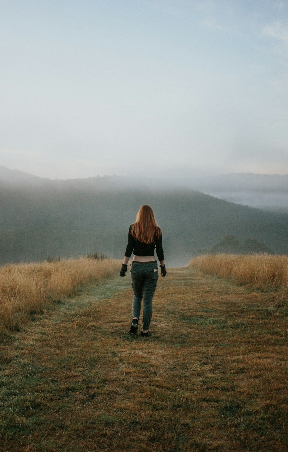 woman standing on grass during daytime