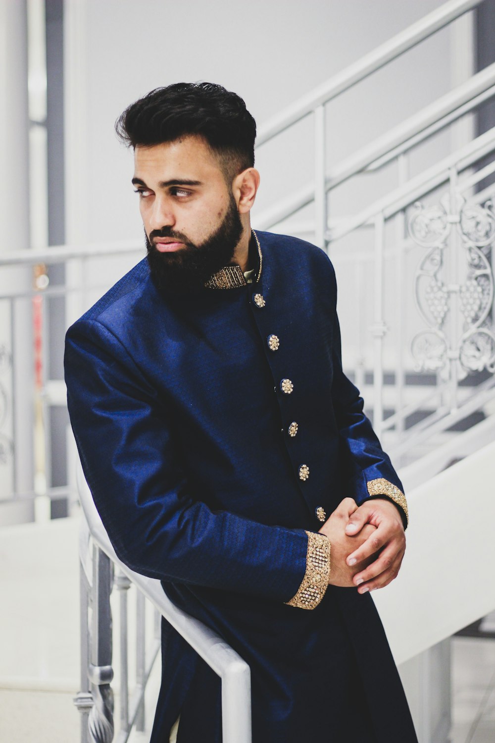 man wearing blue thobe suit