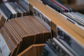 selective focus photography of album cases