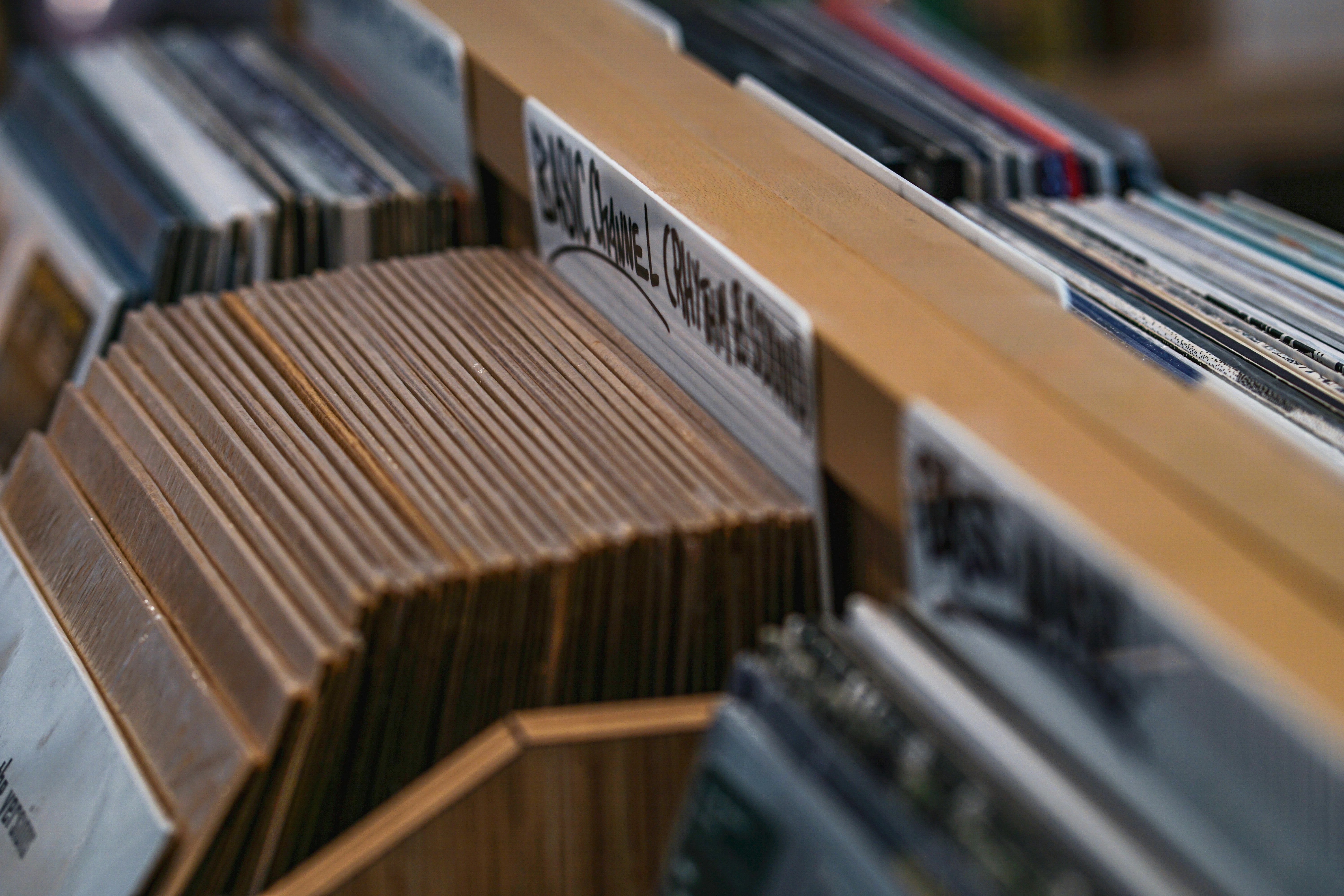 selective focus photography of album cases