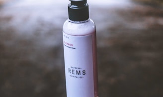 white and black Rems bottle floating