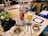 A cozy cafe setting with people enjoying their drinks.