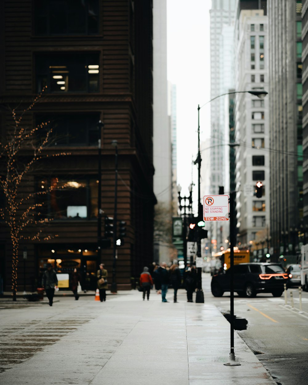 group of people walking beside buildings