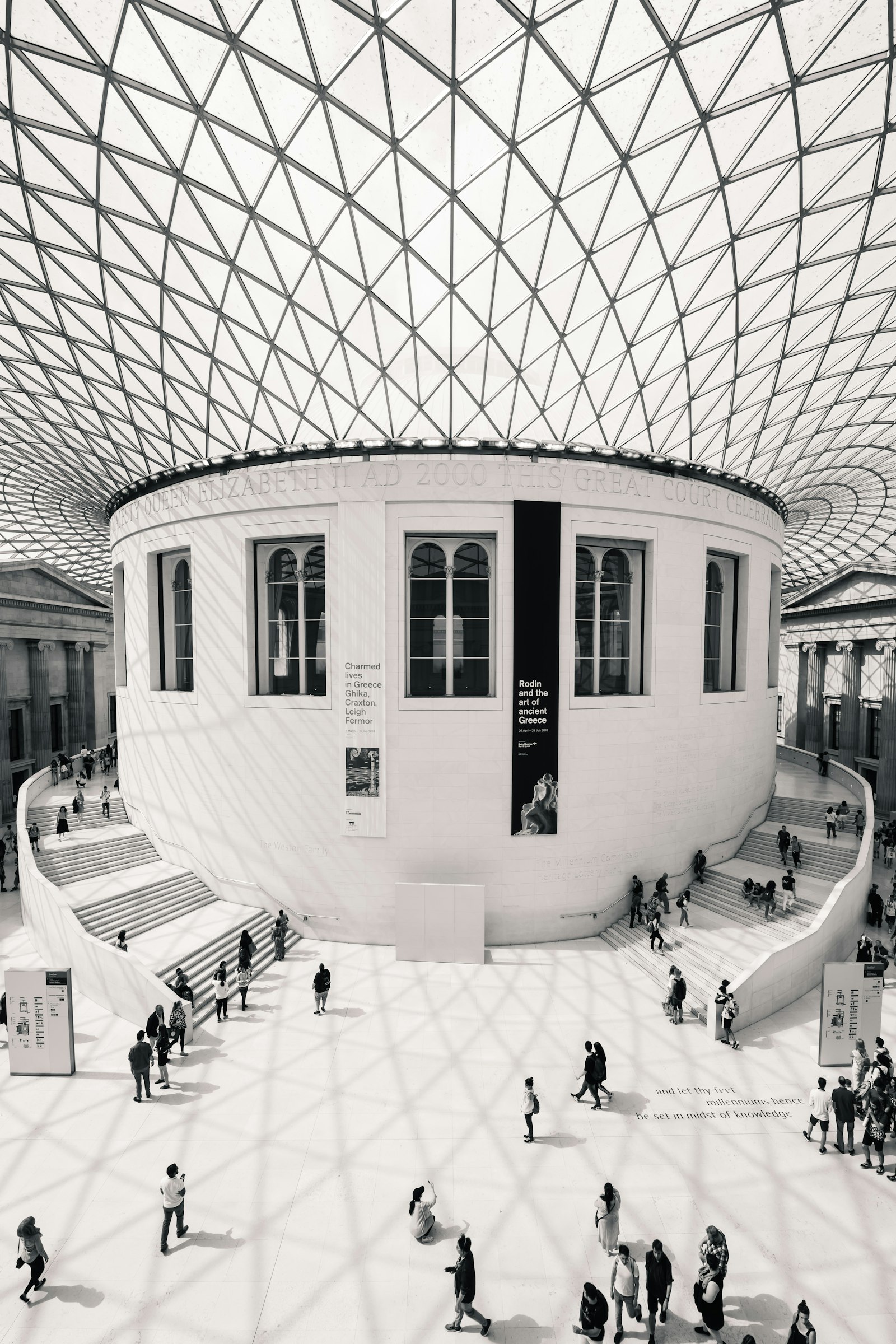 The Great Court of the British Museum with visitors walking beneath the glass roof