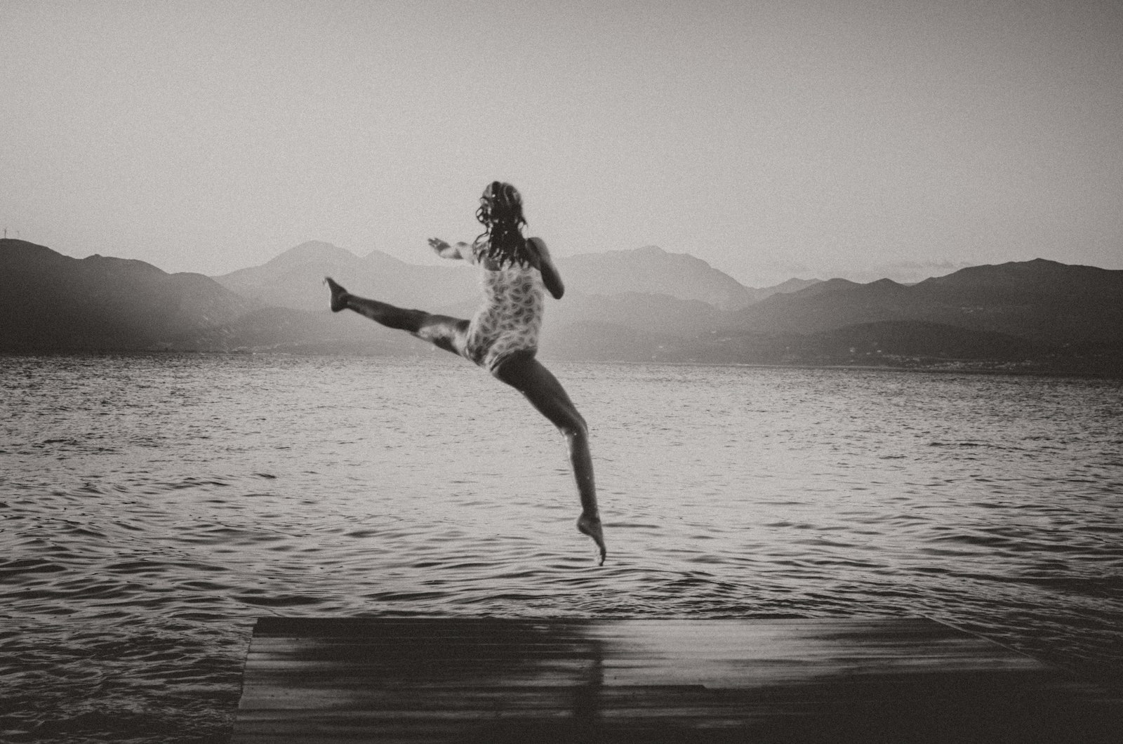 AF Zoom-Nikkor 35-80mm f/4-5.6D N sample photo. Woman jumping on bridge photography