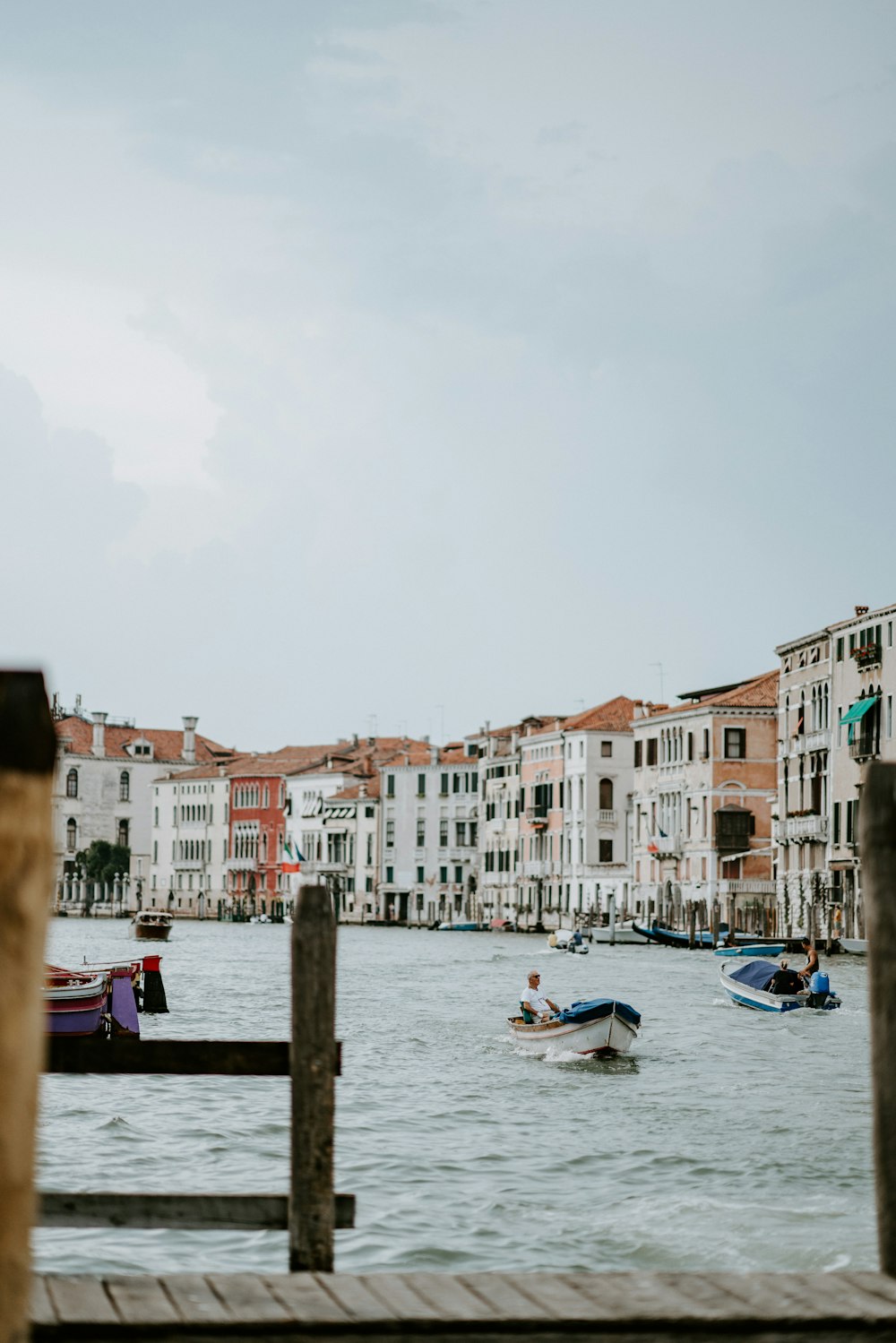 white and brown concrete buildings near body of water