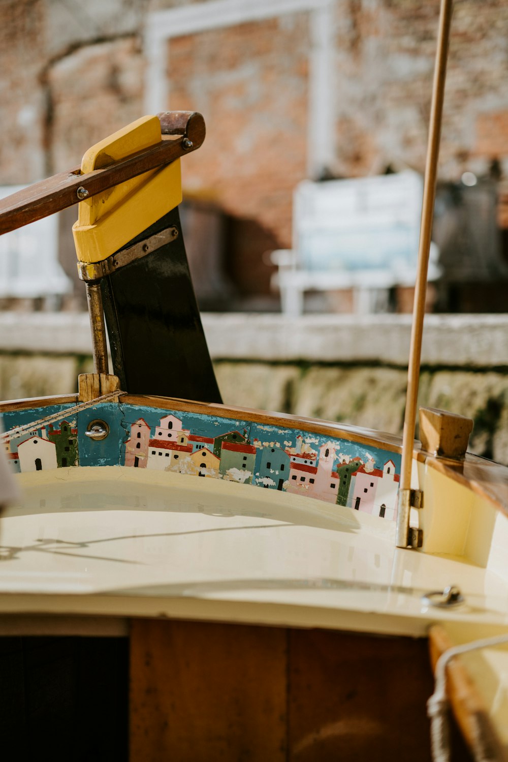 a small boat with a yellow umbrella on top of it