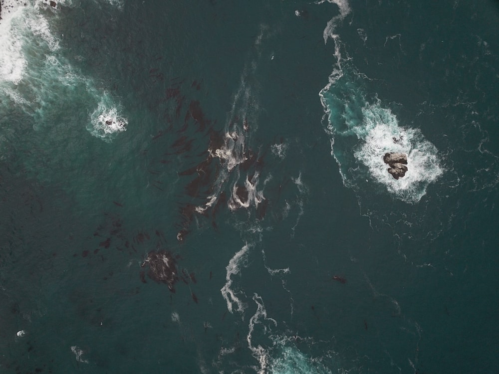 aerial photo of rippling body of water