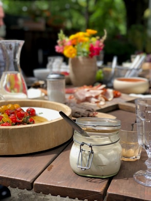 Table set outdoors with homemade dishes and fresh ingredients ready to be enjoyed